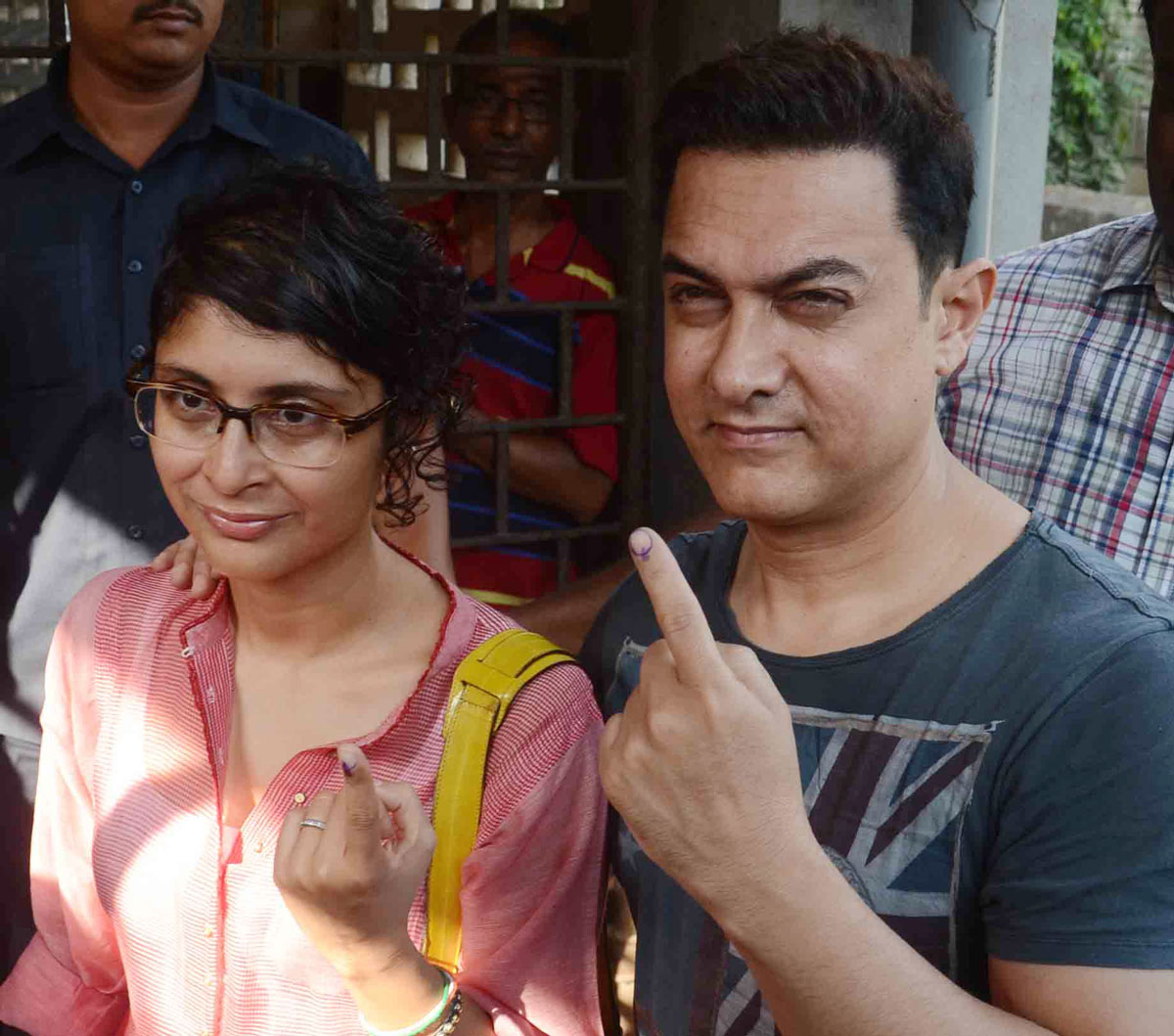 Amir Khan along with his wife Kiran at Voting centre in Pali Hill.