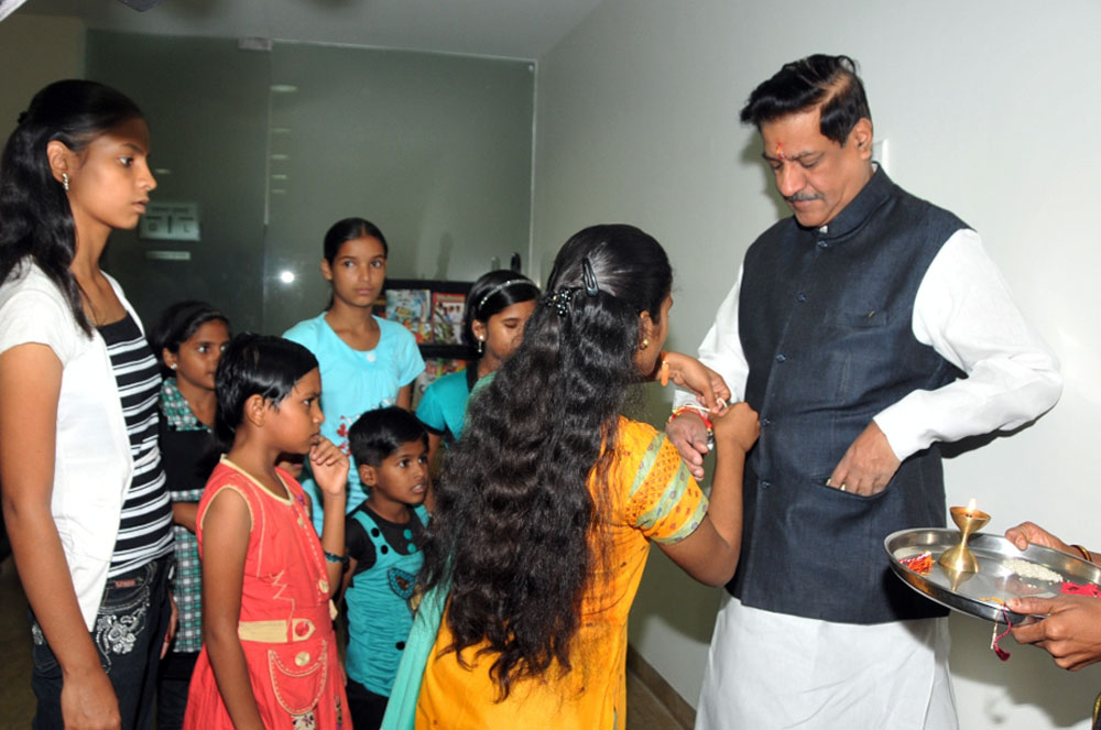 CHIEF MINISTER PRITHVIRAJ CHAVAN ON OCCASION RAKHI PORNIMA AT VARSHA BUNGALOW.