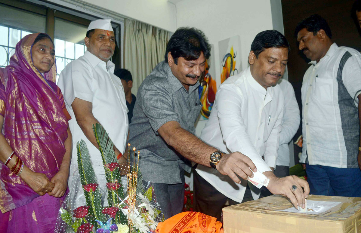 MLA & Ex.Mumbai Congresss President Kripashankar Singh Collecting Chief Minister Relief Fund in his Constituency to Help Victims Under Natural Calamity of Malin Village in Taluka Ambegaon Dist.Pune.