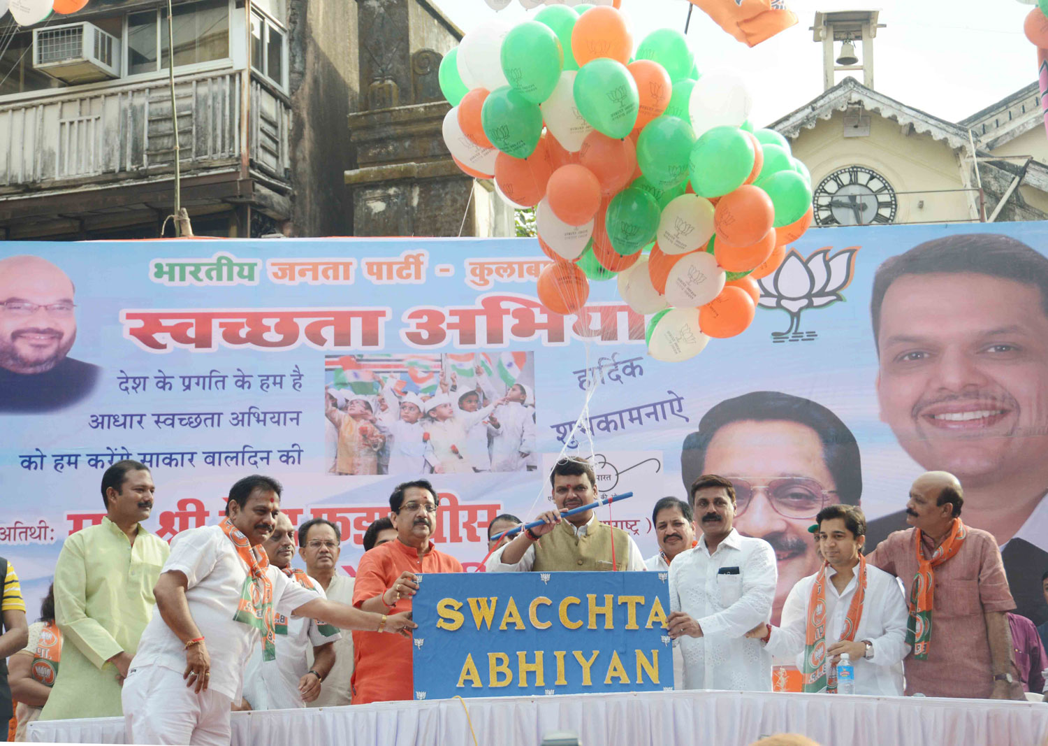 Chief Minister Devendra Fadnavis during "Swacchta Mission" at AP Market in Colaba Assembly.