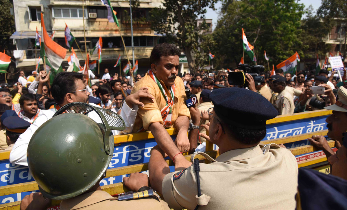 Mumbai Congress President Sanjay Nirupam with Party Workers Protest against BJP Minister Vinod Tawade at his Vile Parle Residence.
