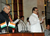 THE PRESIDENT OF INDIA PRANAB MUKHERJEE GIVING OATH TO UNION MINISTER OF STATE TARIQ ANWAR IN A SWEARING CEREMONY AT NEW DELHI.