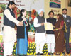 The Prime Minister, Dr. Manmohan Singh Presenting Award For The Best  Performing Gram Panchayat For The Year 2009-10 At The Mahatma Gandhi NREGA Sammelan-2011.